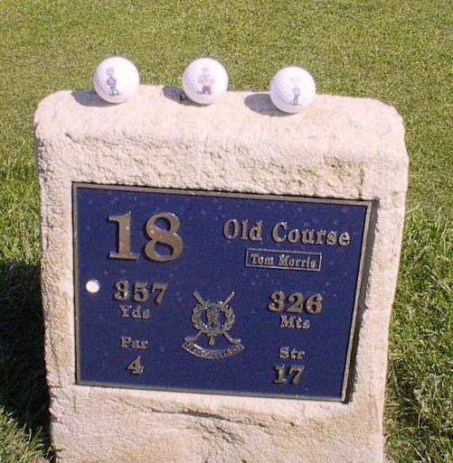 the Pals at the 18th hole marker